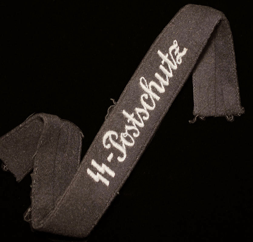 SS Postschutz Cuff Title